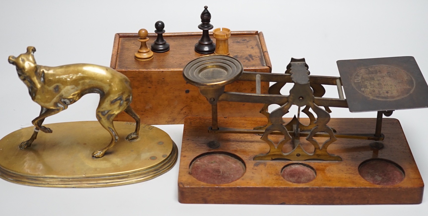 After Mene, a bronze greyhound, a Staunton-pattern chess set and a set of Victorian postal scales, bronze 22cms wide